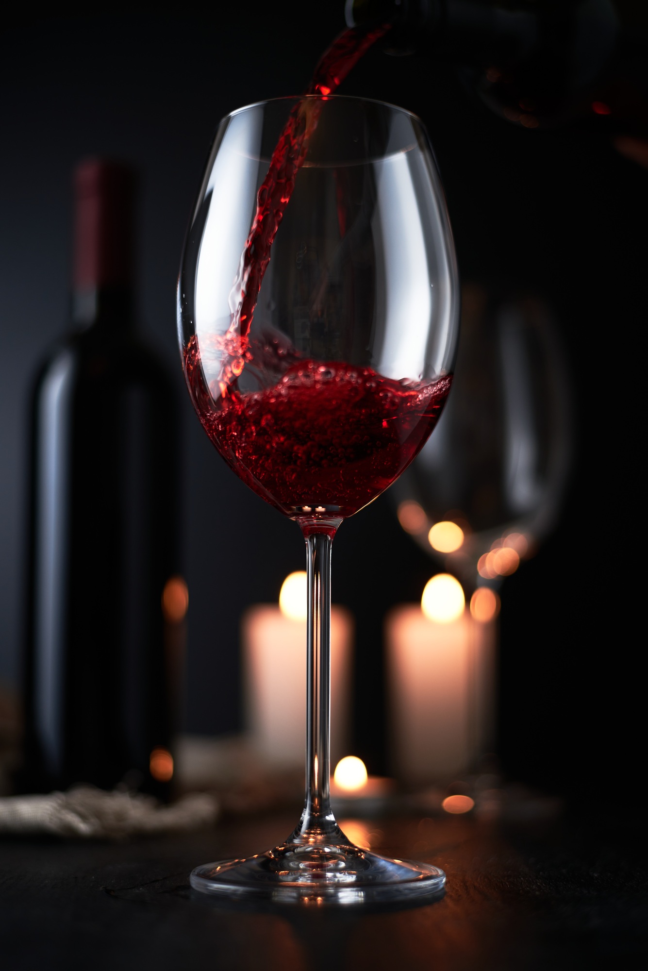 glass of red wine on a dark background. wineglass