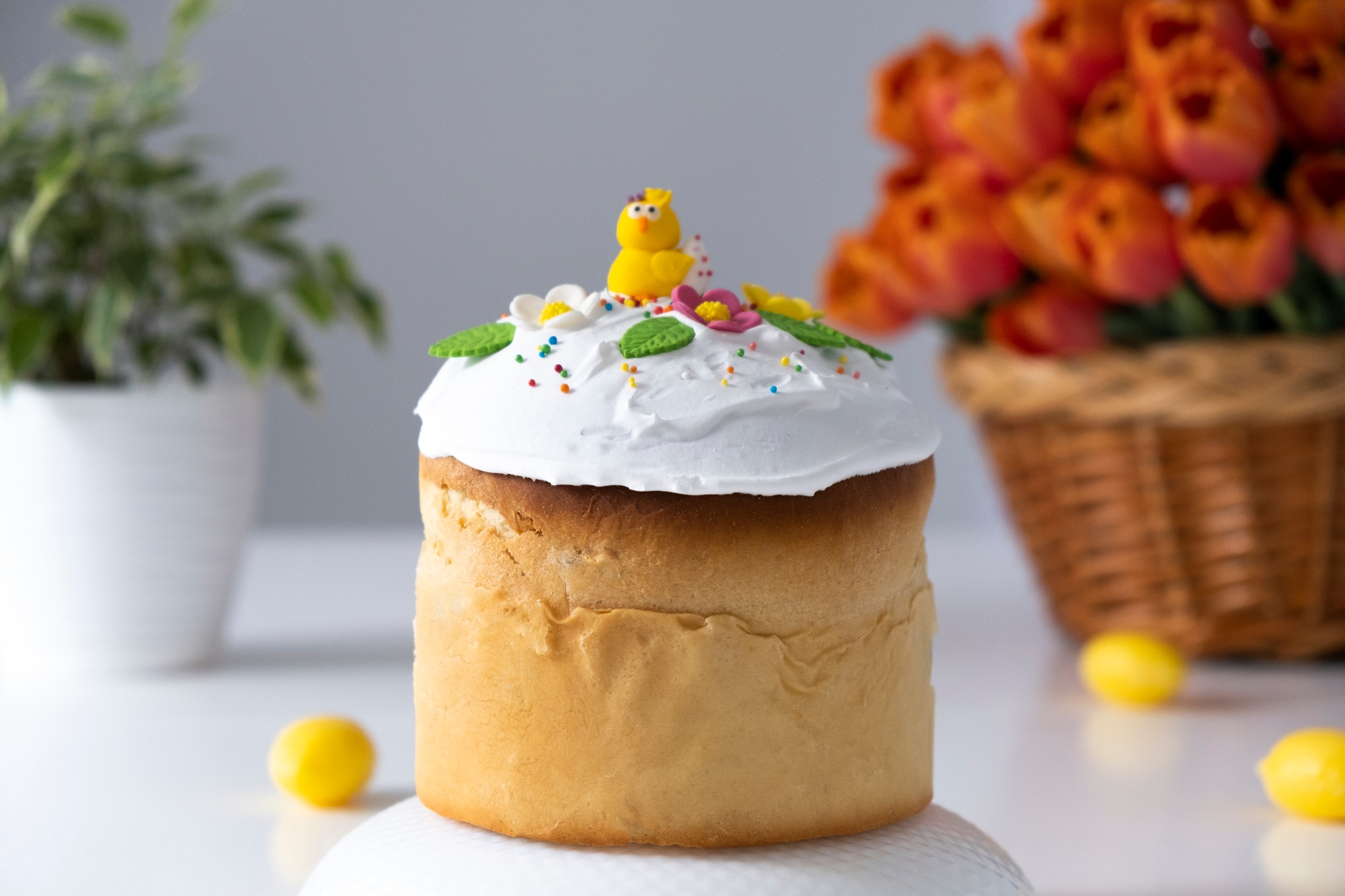 Traditional Easter brioche with glace icing and spring decoration.