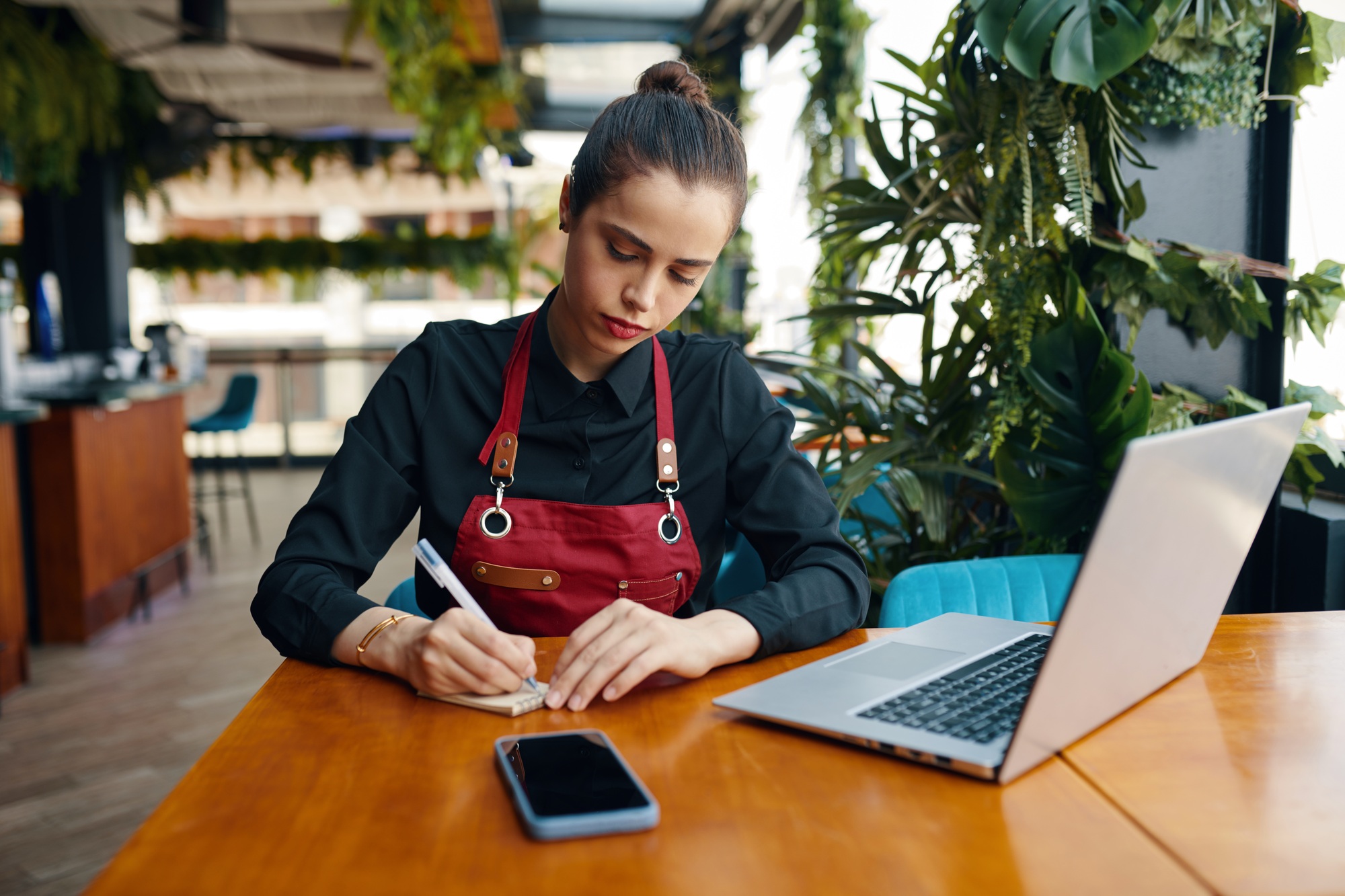 Waiter Writing down Online Reservations
