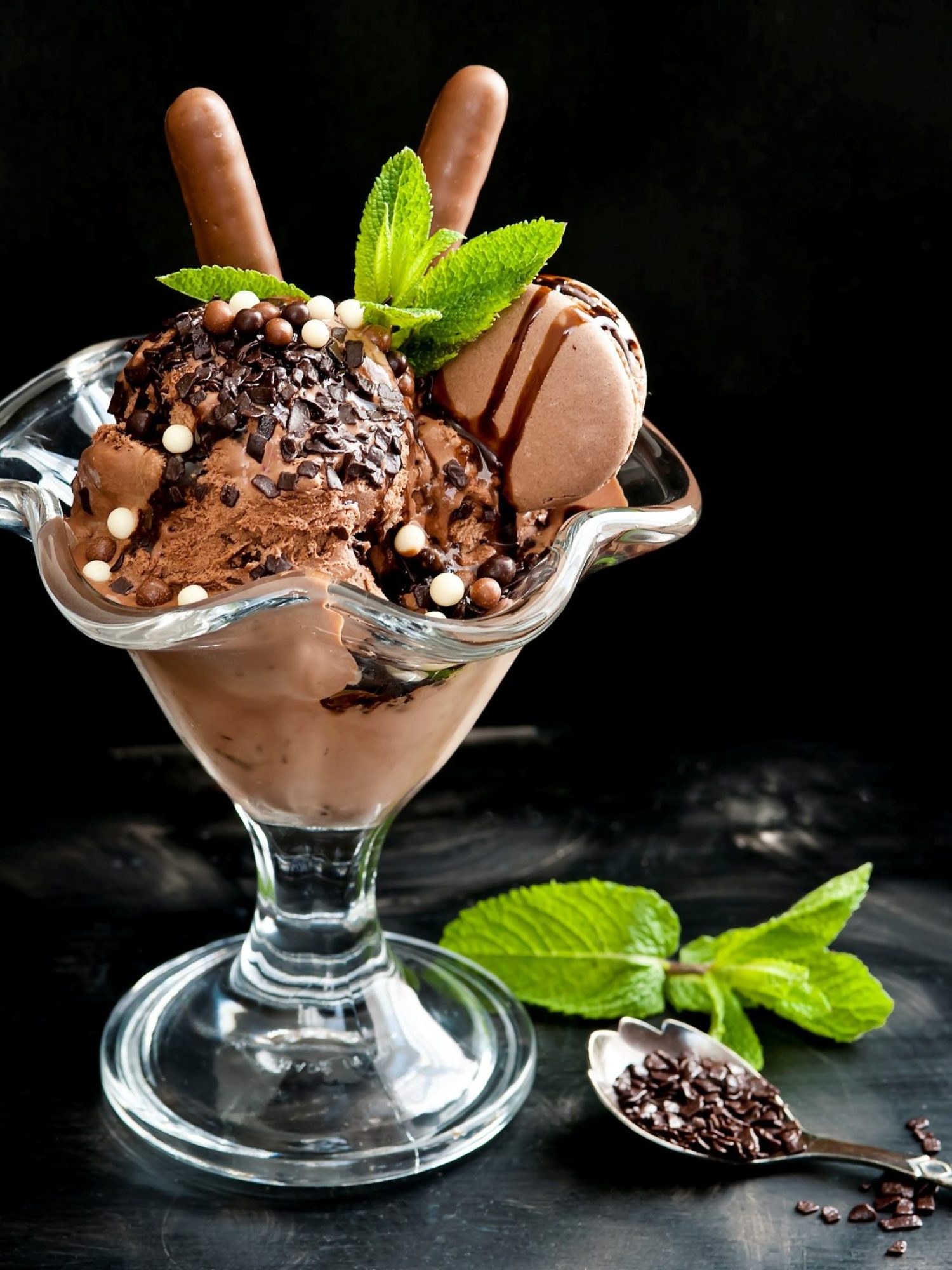 Chocolate ice cream in a cup on a black background